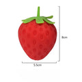 Red strawberry-shaped squishy TheMoodease stress ball, approximately 8 cm in height and 5.5 cm in width, a compact sensory fidget toy for stress relief and hand exercise