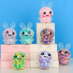 TheMoodease | Light-Up Bunny Stress Balls Set – seven different color bunny stress balls on the desk, easy to carry